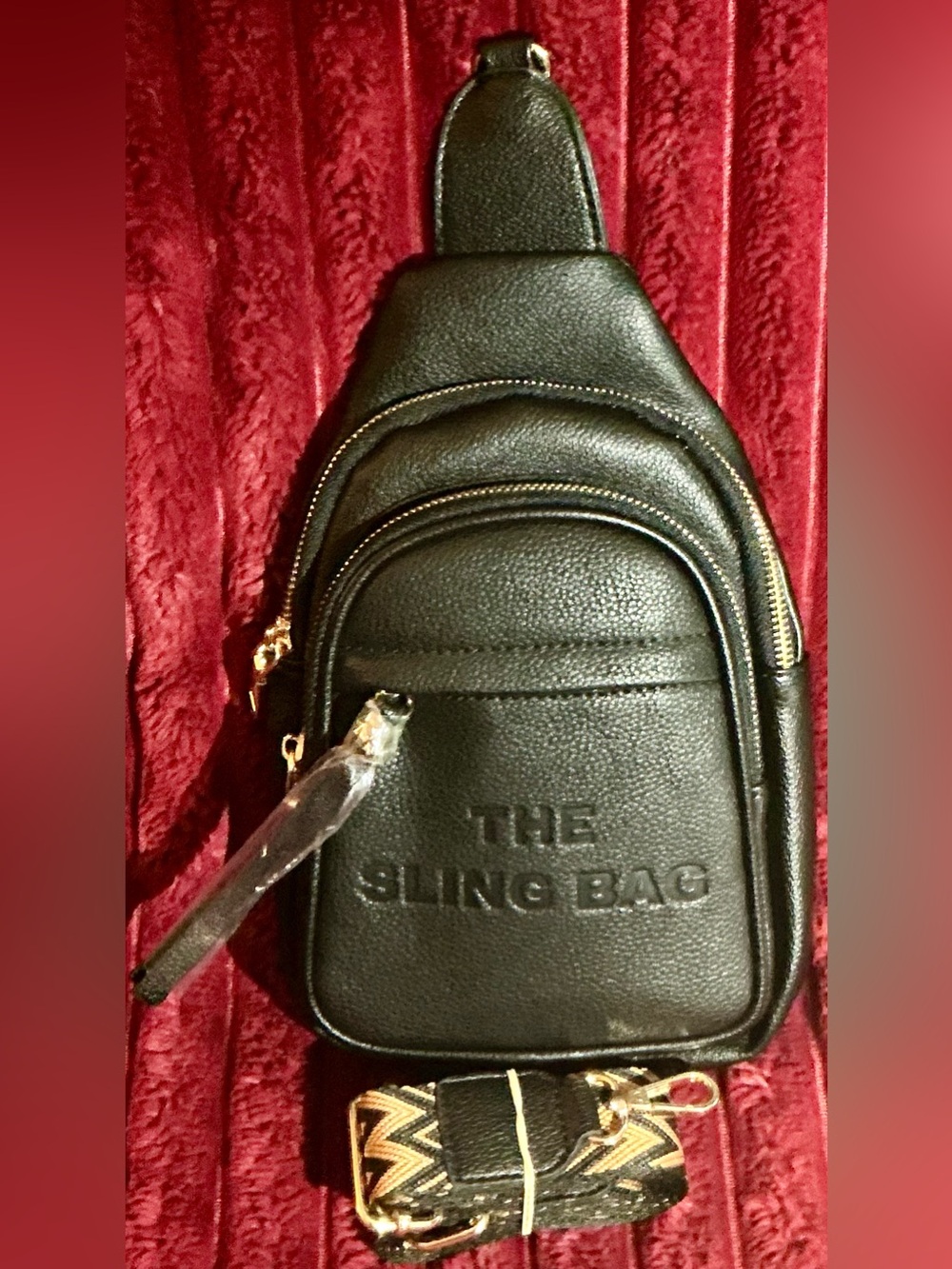 The Sling Bag Black Leatherette Embossed Logo